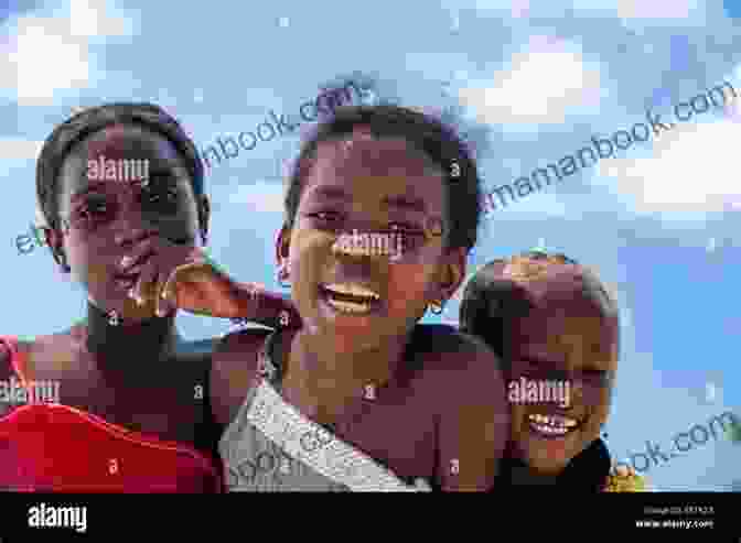 A Group Of Children In Madagascar Looking At A Sunset Over The Ocean Children Of The Dusk (The Madagascar Manifesto 3)